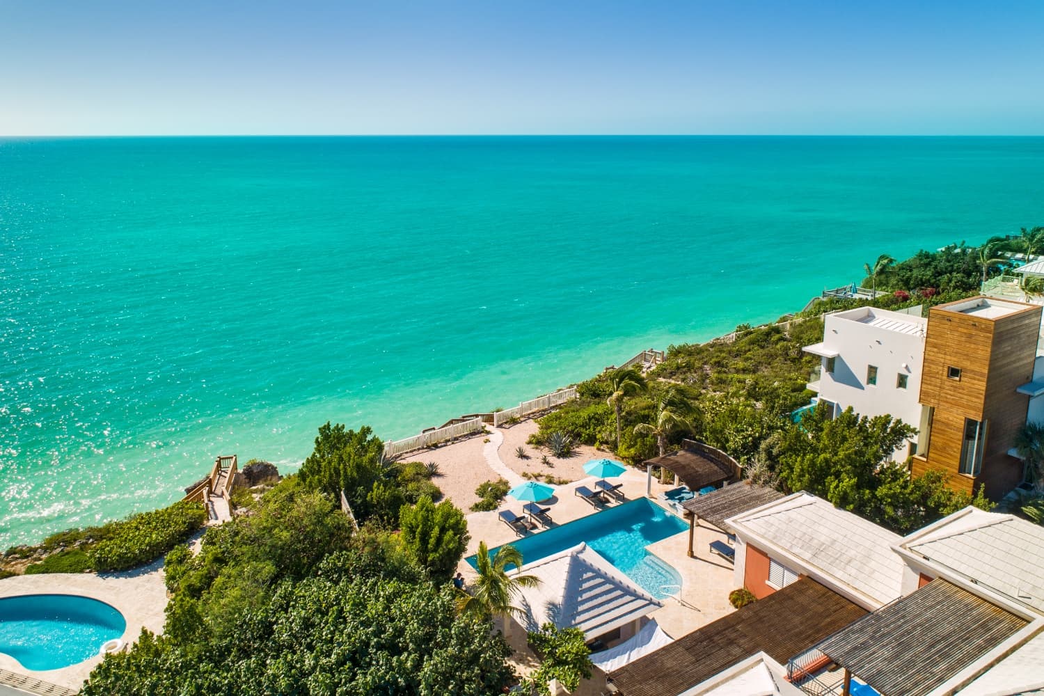 Aerial with house, pool and ocean
