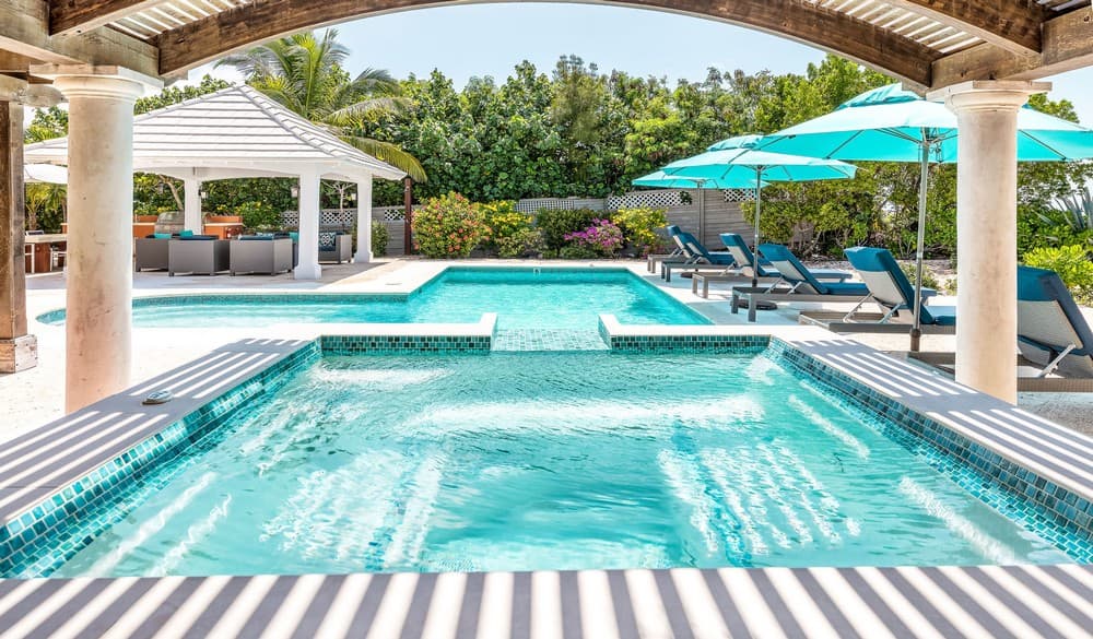 Hot tub view overlooking the pool and cabana